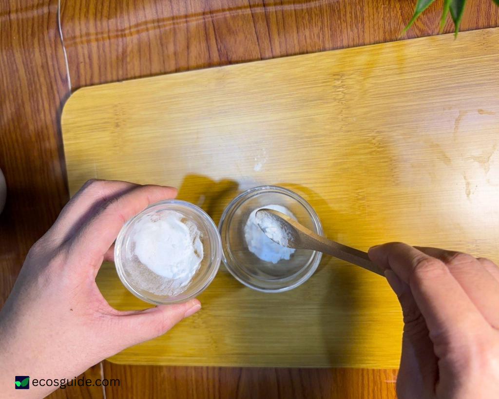 Measuring baking soda into a small bowl to prepare for the dishwasher cleaning cycle
