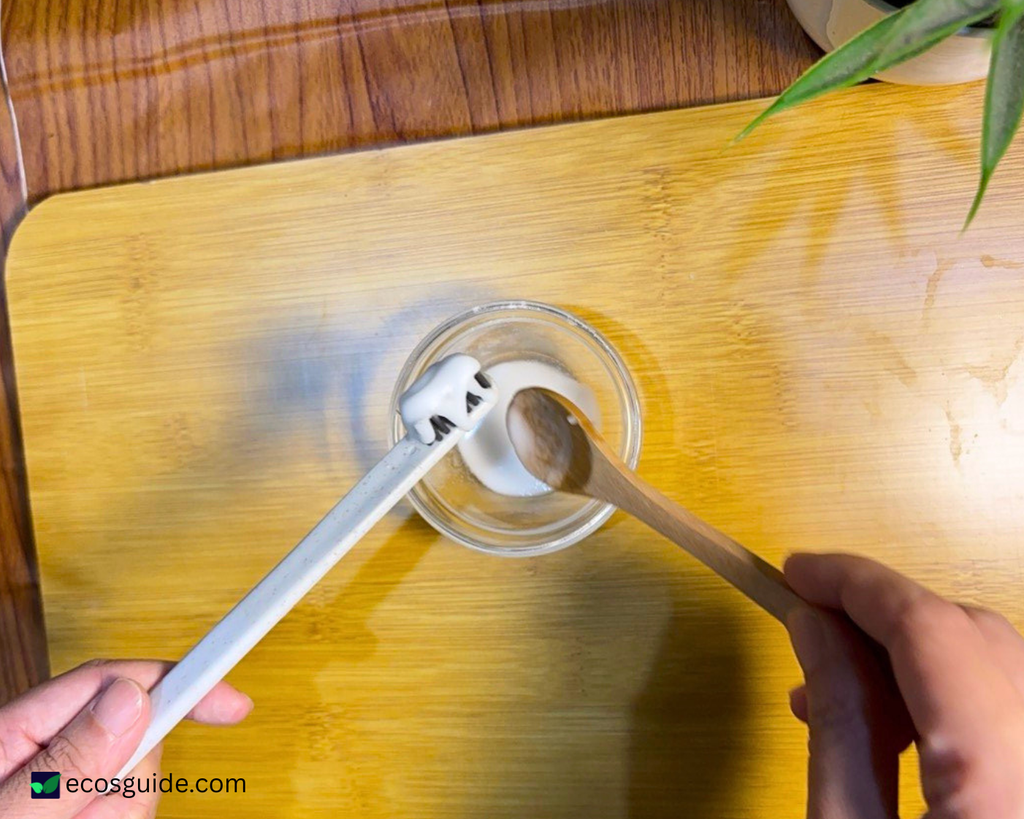 Toothbrush with baking soda and water paste for removing stubborn grime.